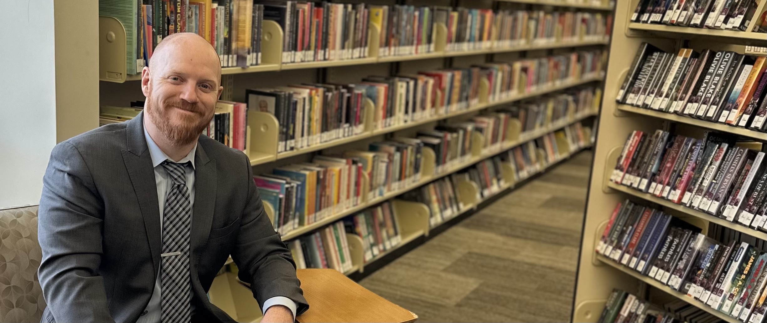 Shannon sitting in the library